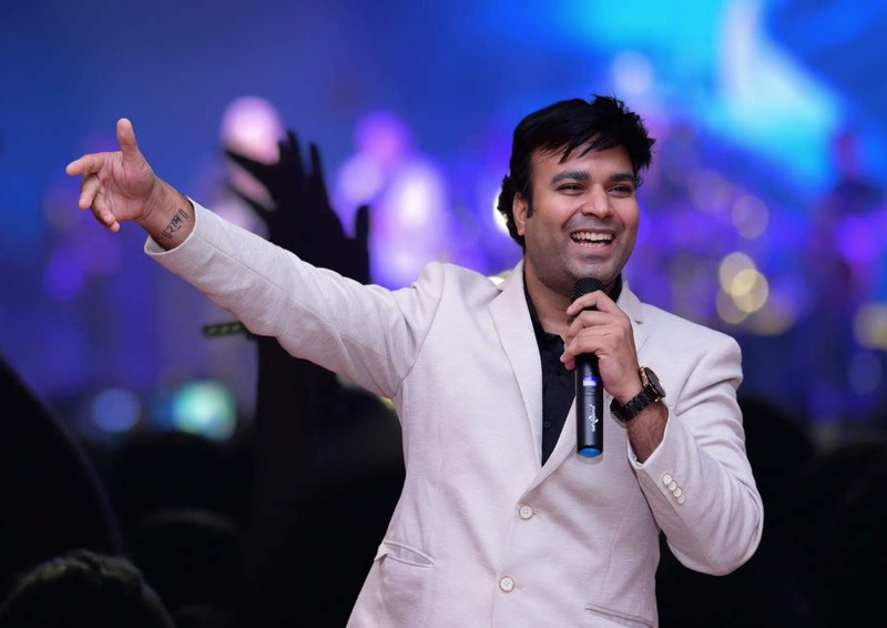 Ashish Gupta speaking on stage